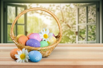 Easter colored eggs on window background