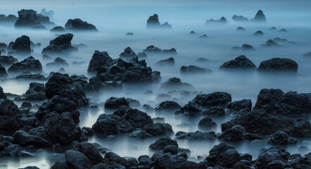 Long exposure photo of rocky beach in Hawaii