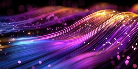 Colorful light trails with a bokeh effect on a dark background, creating a vibrant and dynamic abstract pattern.