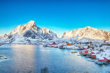 Dramatic evening cityscape of Reine town