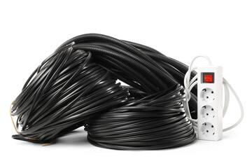 Rolled cables, flexible conduit tube and extension cord on white background