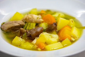 Healthy soup with chicken, vegetables .