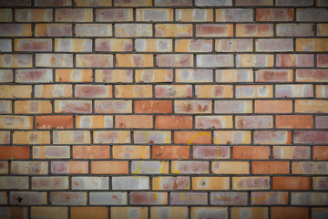 Fototapeta premium A yellow brick wall. The brick wall painted in yellow. 3