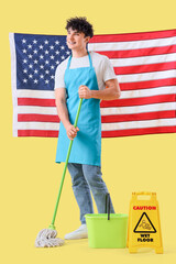 Male janitor with USA flag and floor mop on yellow background