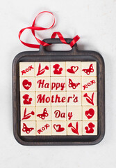 Vegan Delicate square cookies with marmalade filling in a thematic form, happy mother's day, mom, flower, butterfly, mother and child, heart. Decorated with a red satin ribbon. Top view. Mother's Day
