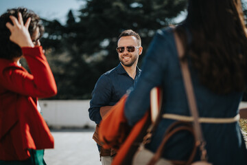 A group of business professionals gather outside in a city to discuss project plans, solutions, and collaborations.