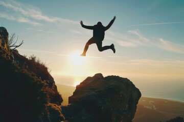 Man Jumping off Cliff Into Air