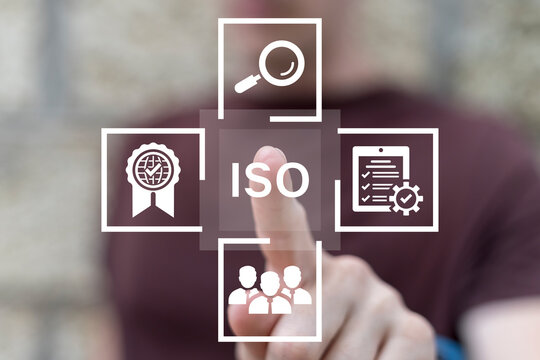 Man using virtual touchscreen clicks text: ISO. ISO standards quality control, assurance and warranty business technology concept. ISO Standard certification. Certified Company ISO Quality Certificate
