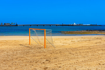 Soccer goal on a sandy beach in Arrecife, Lanzarote Canary Islands. Football field on the sandy beach 