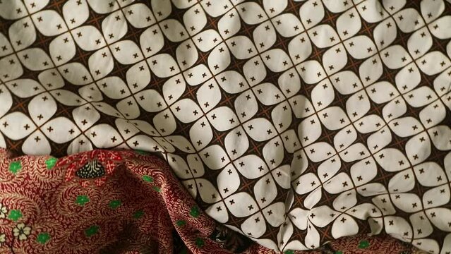 Spinning various motif of batic pattern fabric, Indonesia textured cloth background