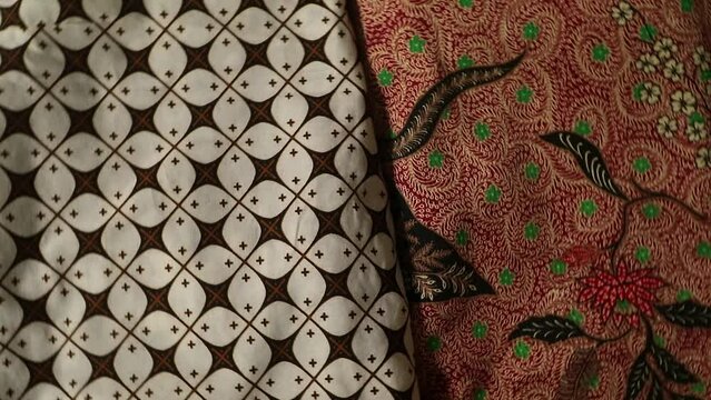 Spinning various motif of batic pattern fabric, Indonesia textured cloth background