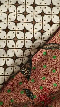 Spinning various motif of batic pattern fabric, Indonesia textured cloth background