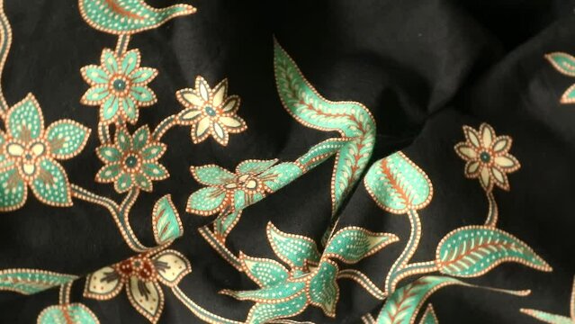 Spinning various motif of batic pattern fabric, Indonesia textured cloth background