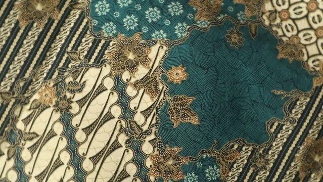 Spinning various motif of batic pattern fabric, Indonesia textured cloth background