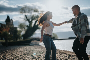 A happy couple shares a dance on a quiet beach, their joyful expressions capturing the essence of a...