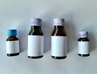 Medicine bottle brown color with blank label white color