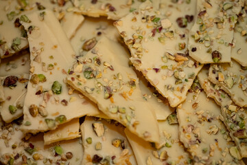 close up of a stack of chocolate, food background, chocolate with pistachio
