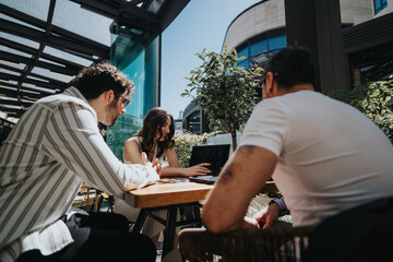 Three business professionals engaging in a discussion at an outdoor cafe setting in an urban...