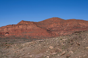 Red Sandstone Cliffs in Southern Utah with the Harmoney Mountains in the distance