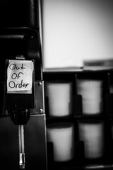 Out of Order sign posted on a soda pop fountain dispenser