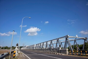 view of a bridge passing by vehicles