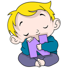 boy is sitting holding the letter N