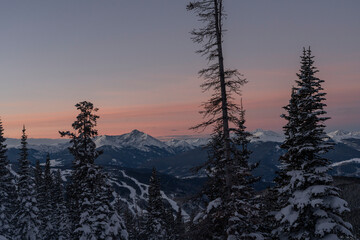 sunrise over a ski area in winter