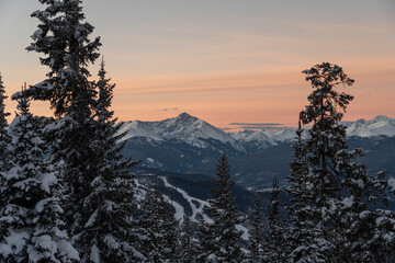 sunrise over a ski area in winter