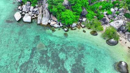 A picturesque blend of golden sands, resilient rocks, and verdant foliage unfolds. Crystal-clear...