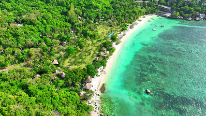 A breathtaking blend of sandy shores, verdant foliage, and a lavish resort, all nestled alongside...