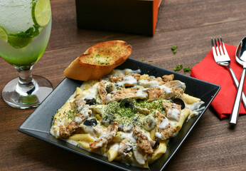 Alfredo Chicken Pasta; A traditional Italian favorite, Tendered pasta tossed in a lite parmesan...