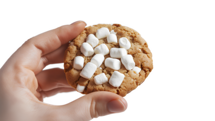 A person holding a cookie with marshmallows on top isolated on a transparent background