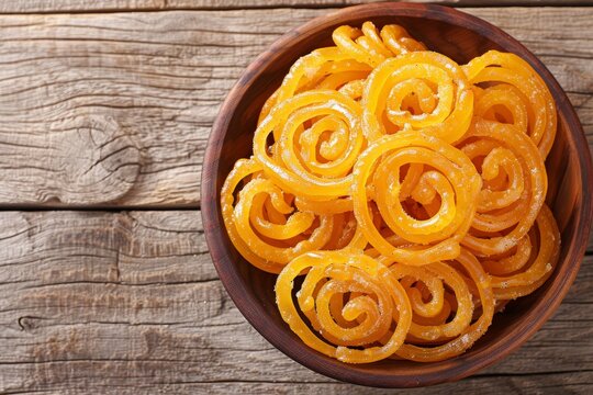 Gujarati snack of crispy Fafda and sweet Jalebi View from the top on wooden background