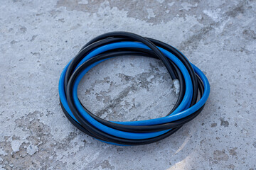 Black and blue electrical wire bundle closeup