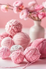 Fototapeta na wymiar Yarn balls in shades of pink crafting concept