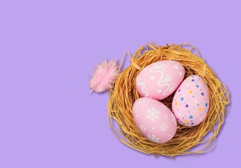 Colorful fresh Easter eggs in basket on colored background
