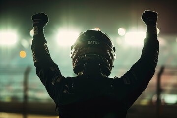 Race car driver celebrates victory in slow motion against stadium lights