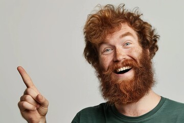 Smiling man with beard pointing to left symbolizing positive emotions
