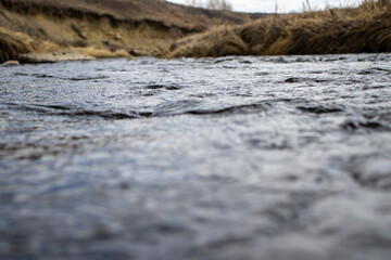 Calm River Flowing Through Grassy Valley