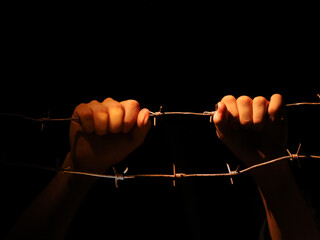 Hands on barbed wire. Concept. Sexual abuse , Stop violence.