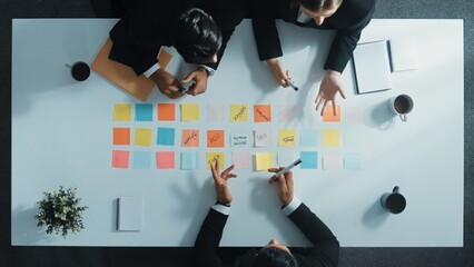 Top view of professional business team planning marketing strategy. Skilled group of diverse...