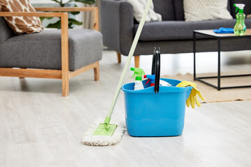 Cleaning, floor and bucket with mop in home for hygiene, disinfection and bacteria for maid...
