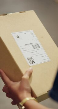 Person, package and hands to scan box for inventory stock take, distribution or supply chain shipping delivery. Ecommerce service, barcode and logistics industry employee working in factory warehouse