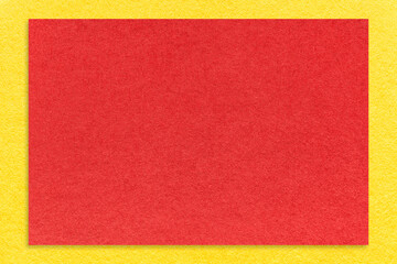 Texture of craft red color paper background with yellow border, macro. Vintage kraft cardboard