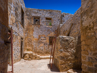 Repair work on an old fortress ruin in progress (Spinalonga Island, Crete, Greece) - obrazy, fototapety, plakaty