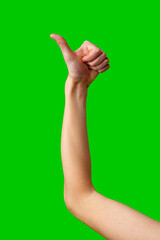 Person Giving a Thumbs Up Gesture Against a Green Screen Background