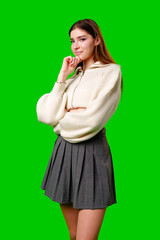 Woman in Skirt and Sweater Posing for Picture