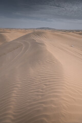 The background image of the sand texture created by the wind, erosion