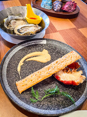 Elegant Seafood Delight with Oysters and Lobster Tail