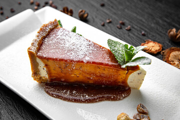 Caramel cheesecake dessert. Menu for a pub on a dark background. Colorful juicy food photography.
